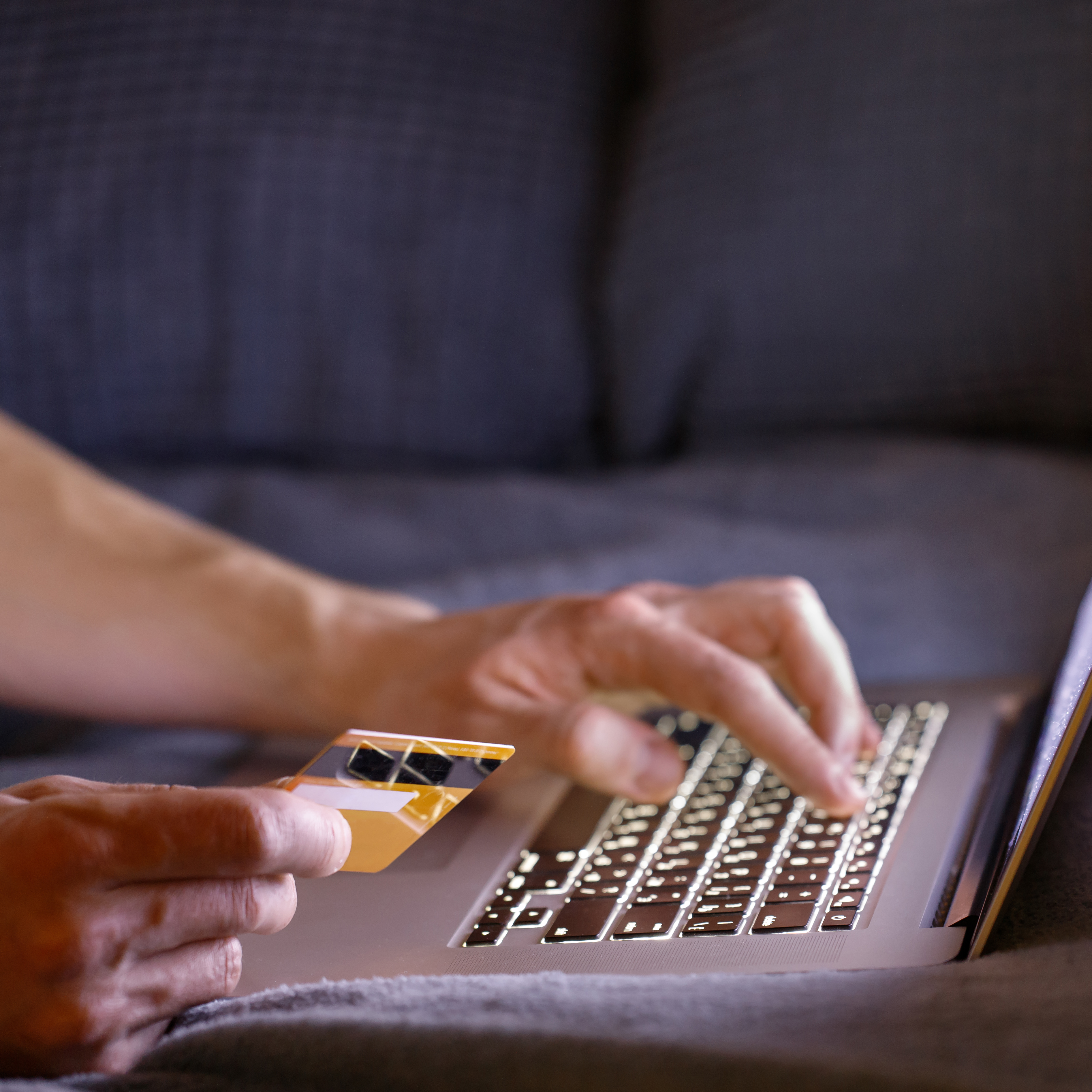 Man hands holding credit card, paying online